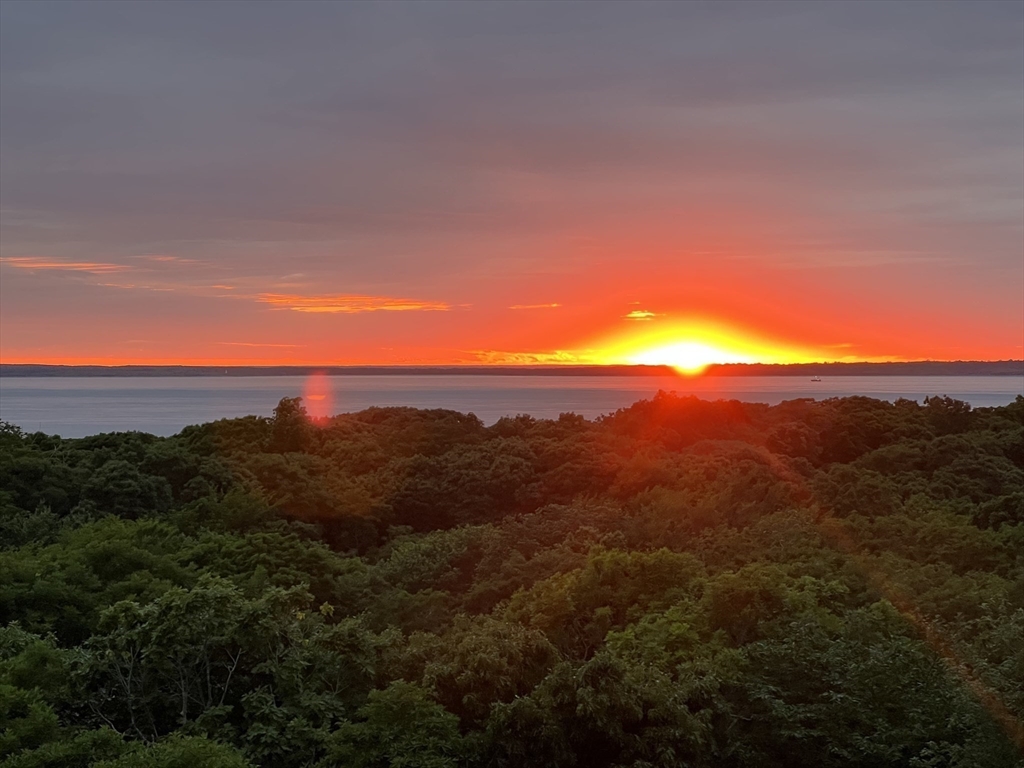 97 Longview Road West Tisbury, MA 02568 - Photo 5 of 42 a view of sunset and mountains