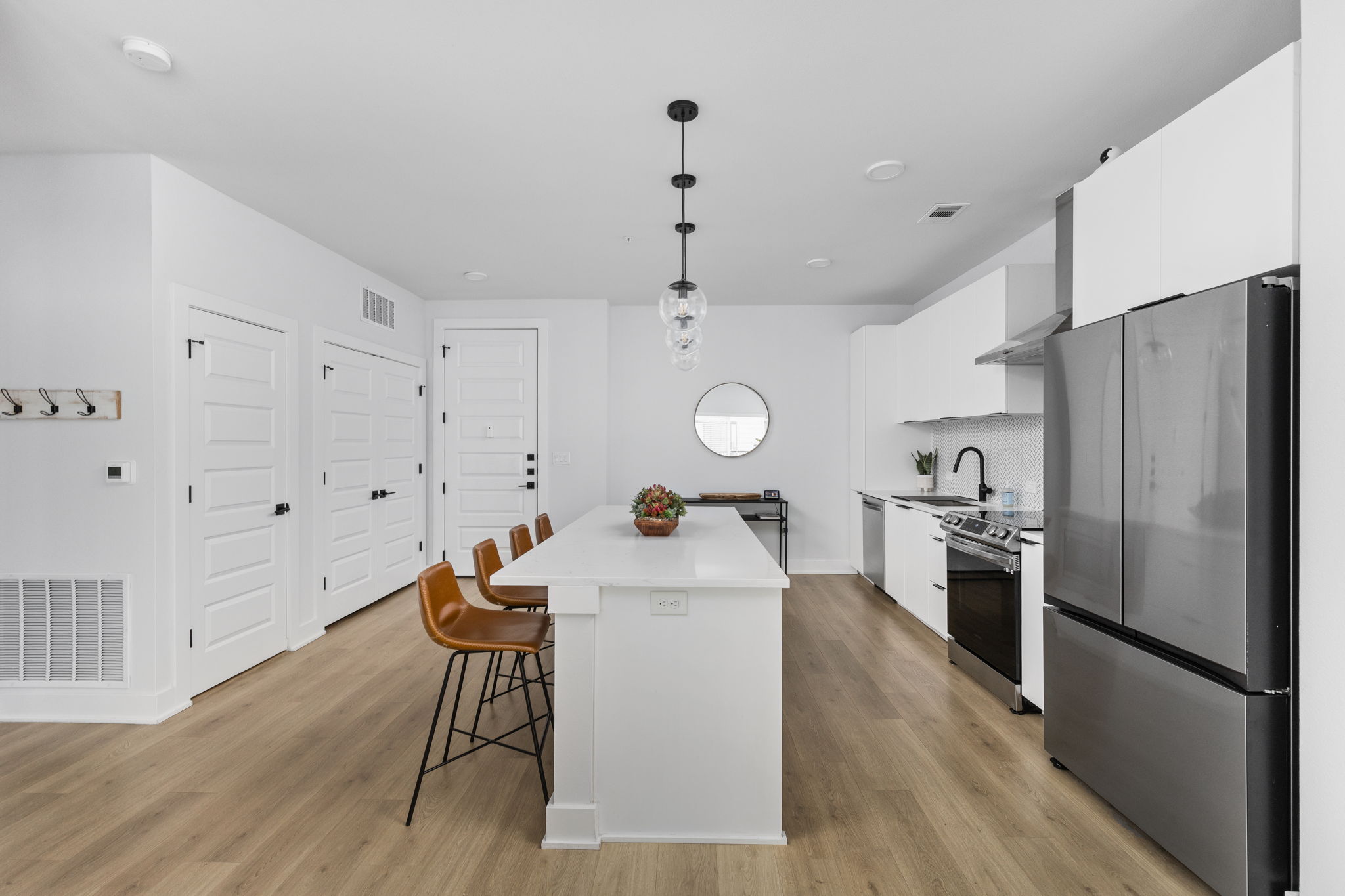 2500 Longview Street, Unit 507 Austin, TX 78705 - Photo 11 of 37 A well-lit kitchen with sleek appliances and ample counter space for culinary endeavors.
