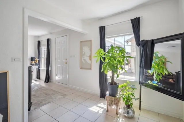a kitchen with white cabinets and appliances