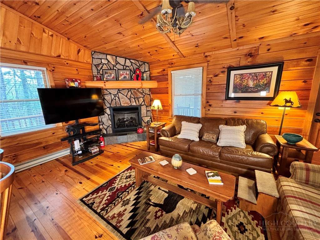 150 Turkey Ridge Crumpler, NC 28617 - Photo 18 of 40 a living room with furniture and a fireplace