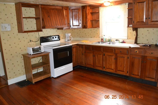 36 Brown Road Shirley, MA 01464 - Photo 2 of 8 a kitchen with stainless steel appliances granite countertop a stove a sink dishwasher and a microwave oven with cabinets