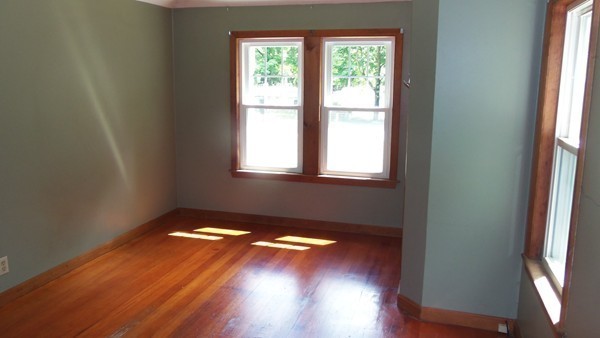 36 Brown Road Shirley, MA 01464 - Photo 5 of 8 a view of an empty room with wooden floor and a window