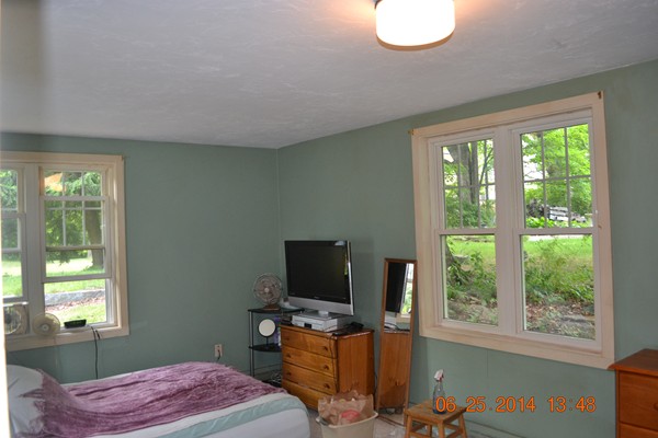 36 Brown Road Shirley, MA 01464 - Photo 8 of 8 a bedroom with a bed and a flat tv screen on the table