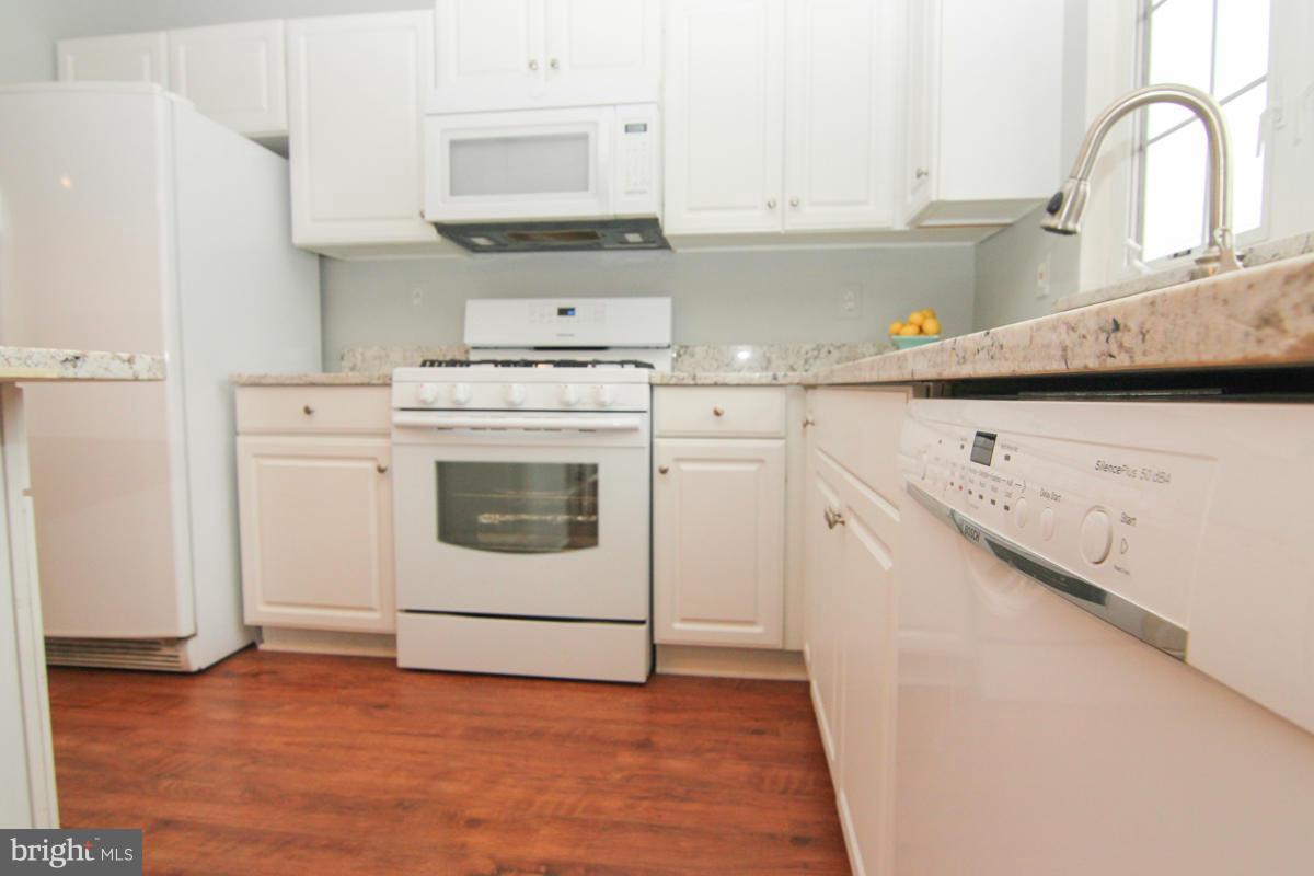 636 Howards Loop Annapolis, MD 21401 - Photo 6 of 29 Love those floors and white cabinets!
