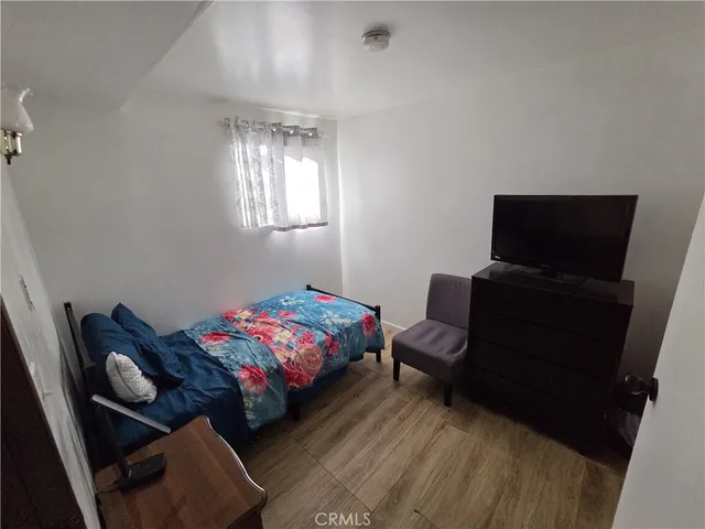 a bedroom with furniture and a window