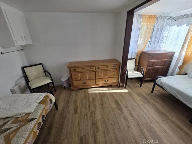 a view of a livingroom with furniture and a window