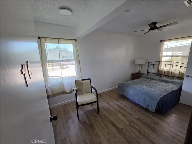 a bedroom with a bed and a couch