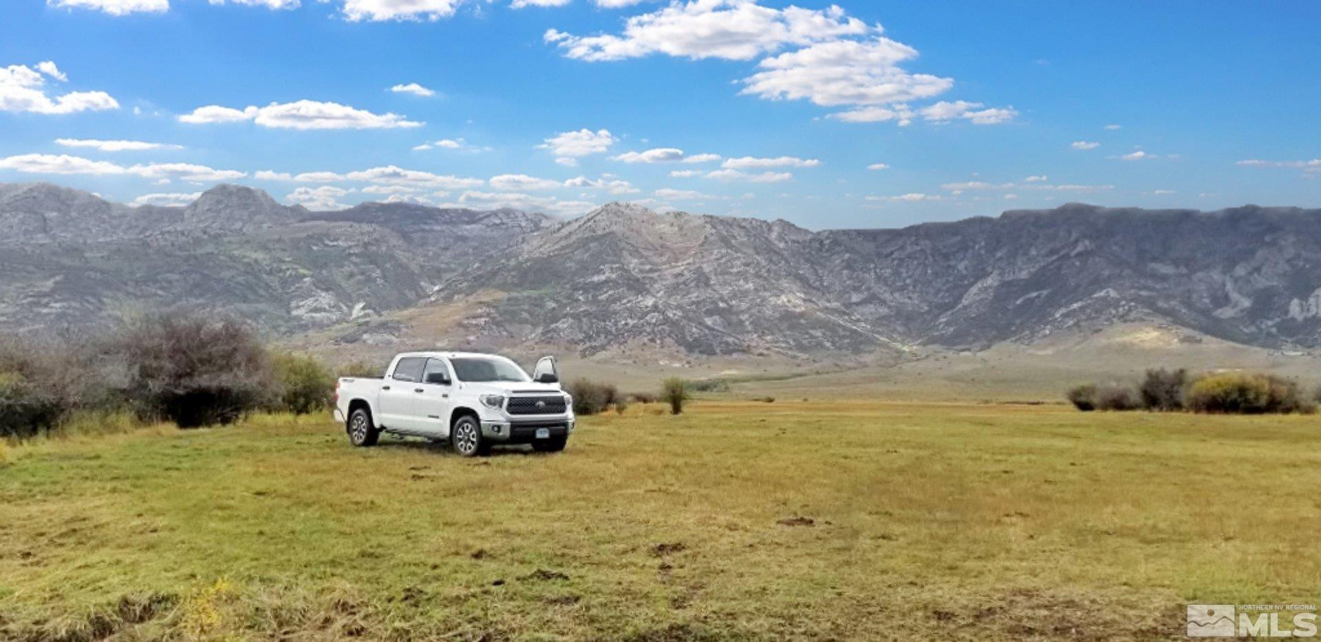 10873 Ruby Valley Road Spring Creek, NV 89815 - Photo 2 of 28 a car parked on the side of a mountain