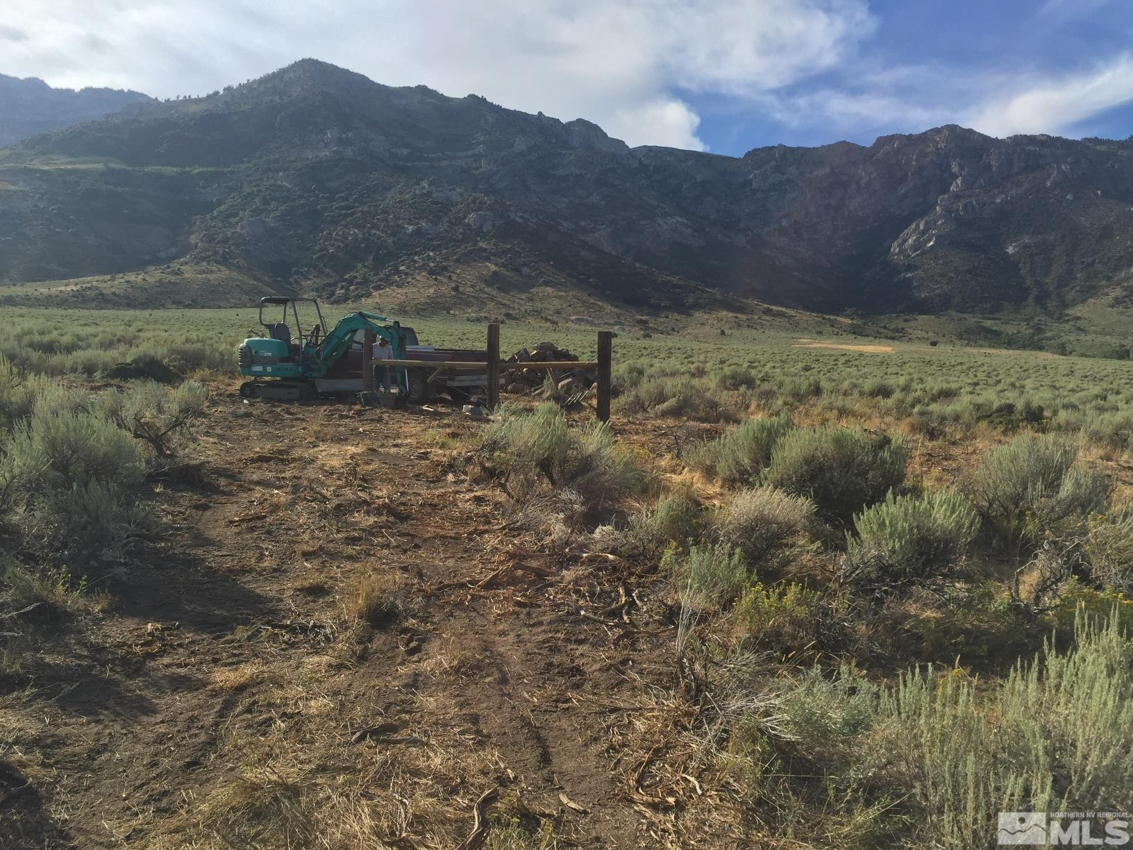 10873 Ruby Valley Road Spring Creek, NV 89815 - Photo 7 of 28 a view of a house with a mountain and a forest