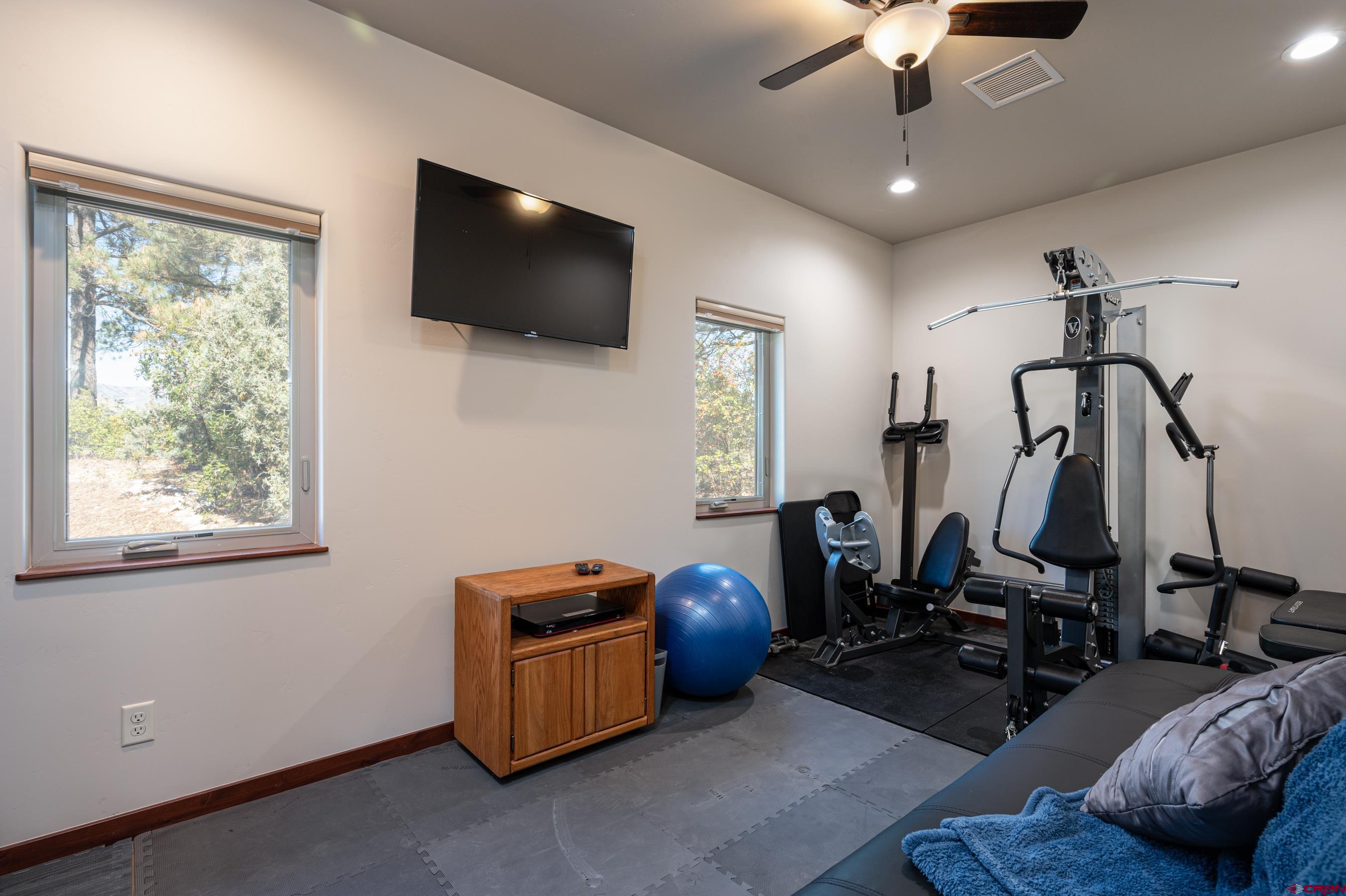 180 Ridge Road Durango, CO 81303 - Photo 19 of 35 a room with furniture and a flat screen tv