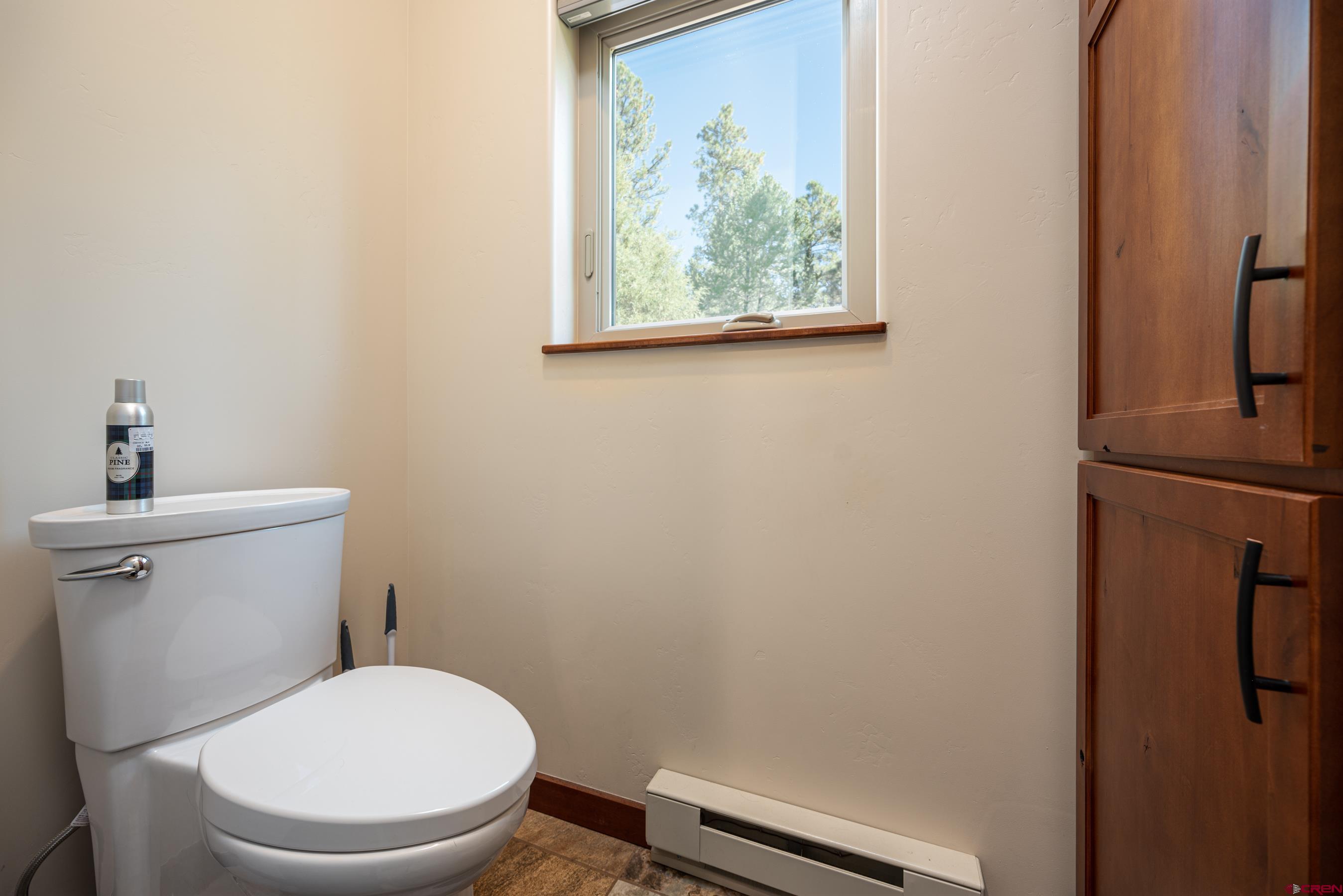 180 Ridge Road Durango, CO 81303 - Photo 24 of 35 a bathroom with a granite countertop sink and a mirror