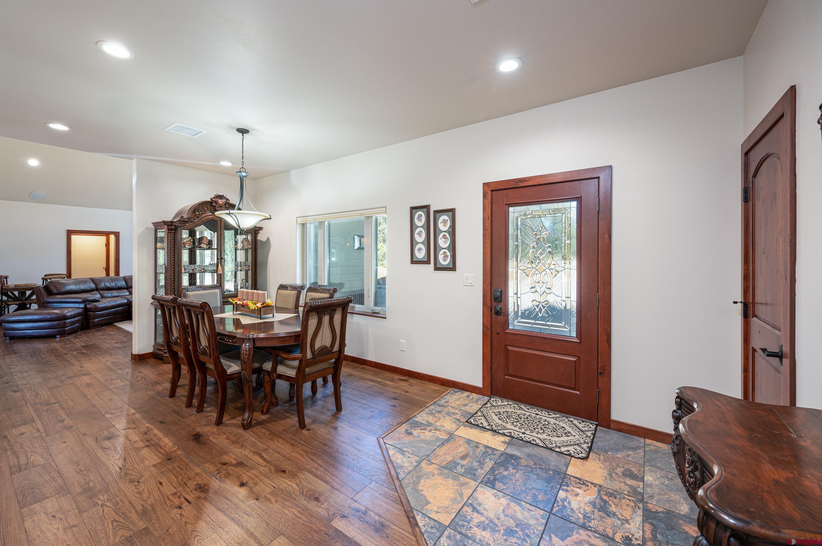 180 Ridge Road Durango, CO 81303 - Photo 4 of 35 a view of a a dining room with furniture window and wooden floor