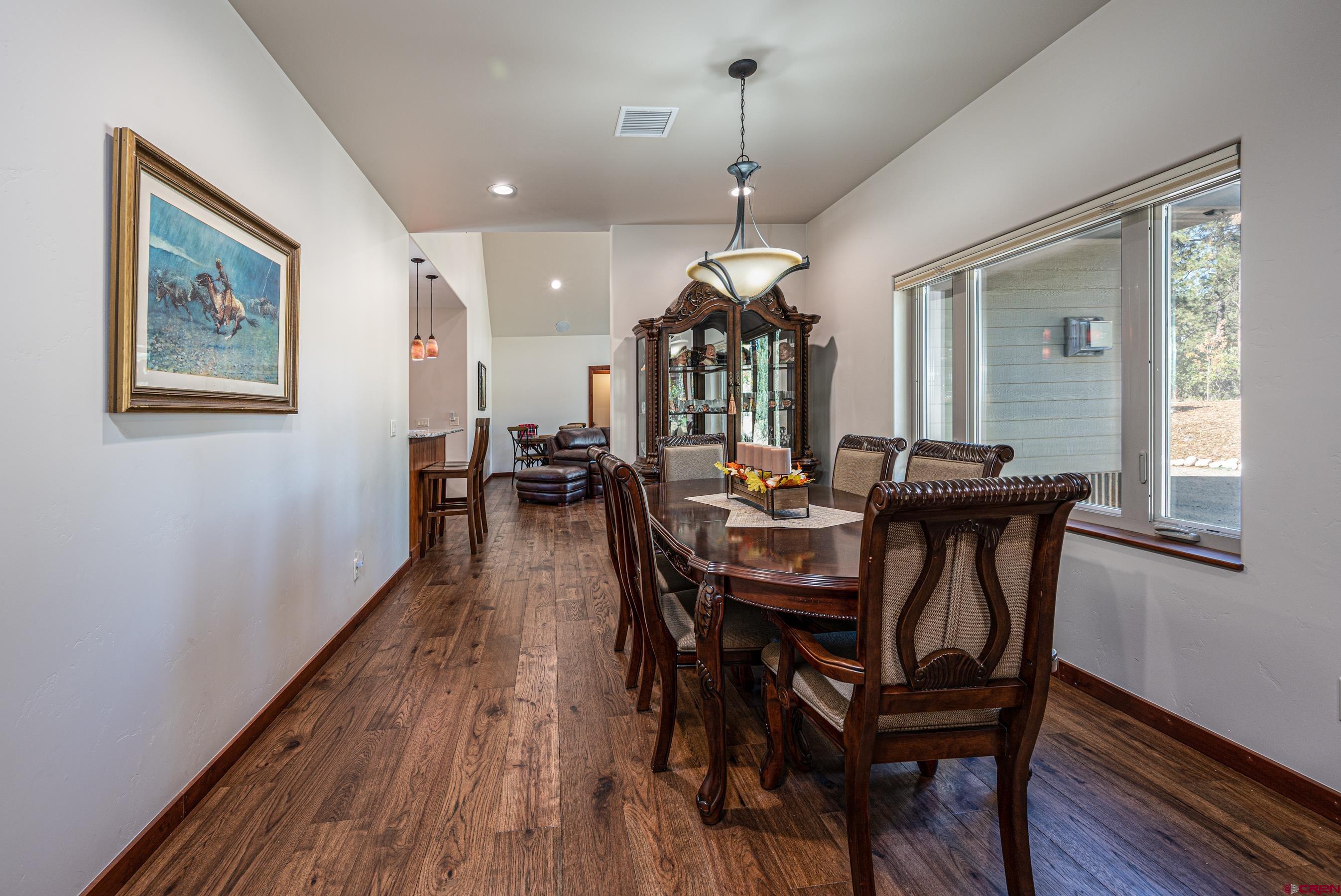 180 Ridge Road Durango, CO 81303 - Photo 5 of 35 a view of a dining room with furniture window and wooden floor