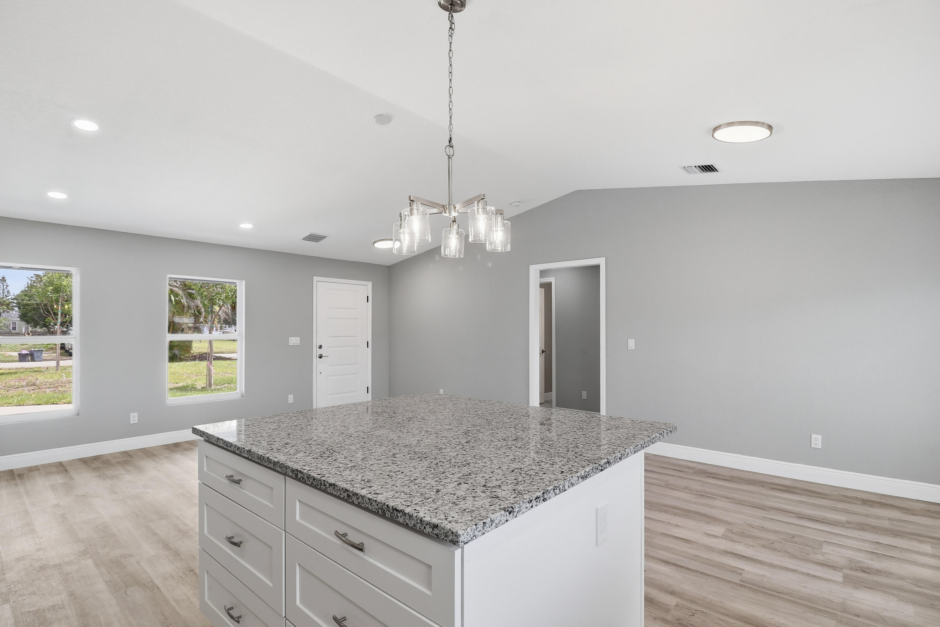 2805 Southeast Carroll Street Stuart, FL 34997 - Photo 10 of 21 a bathroom with a granite countertop sink and a mirror