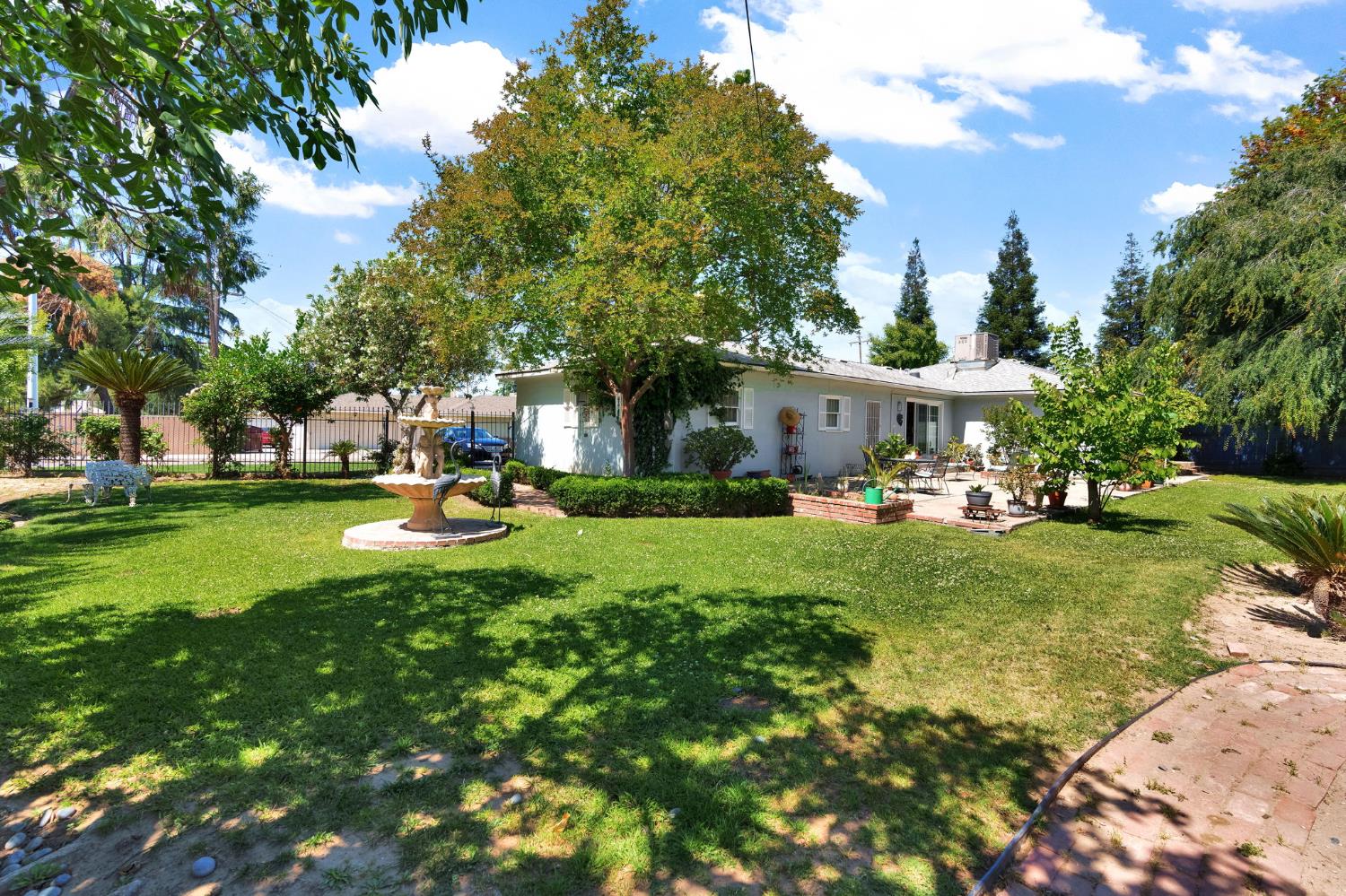 200 Lyons Street Madera, CA 93638 - Photo 31 of 32 a view of a house with a yard porch and sitting area