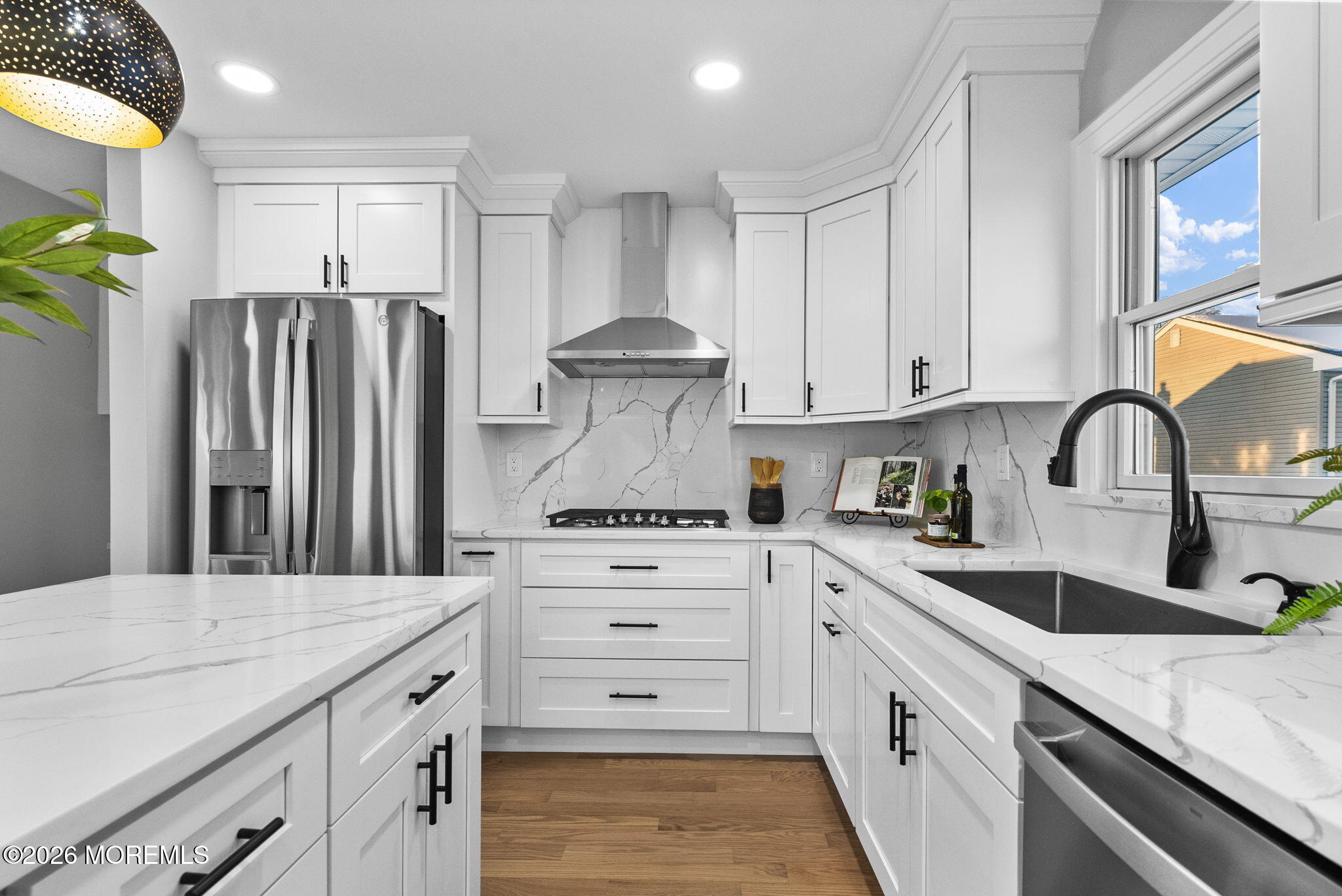 64 South Cliff Road Colonia, NJ 07067 - Photo 11 of 49 a kitchen with granite countertop a white stove refrigerator and cabinets