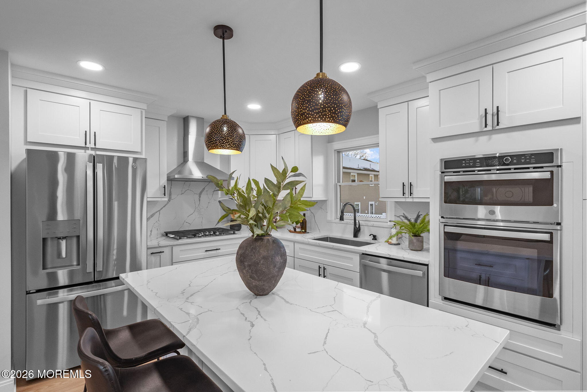 64 South Cliff Road Colonia, NJ 07067 - Photo 12 of 49 a kitchen with stainless steel appliances kitchen island granite countertop a stove a refrigerator and a sink