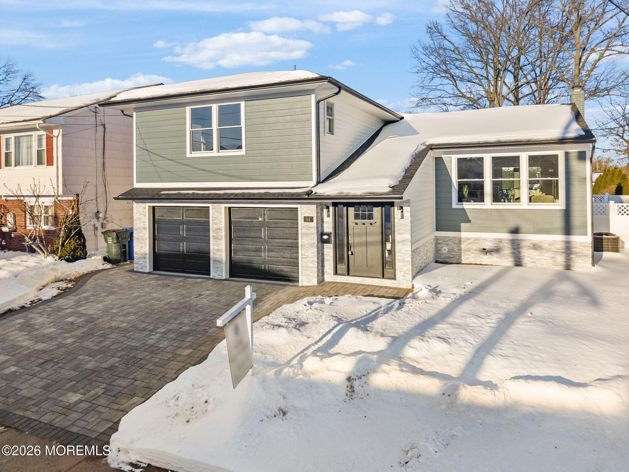 64 South Cliff Road Colonia, NJ 07067 - Photo 2 of 49 a front view of a house with a yard and garage