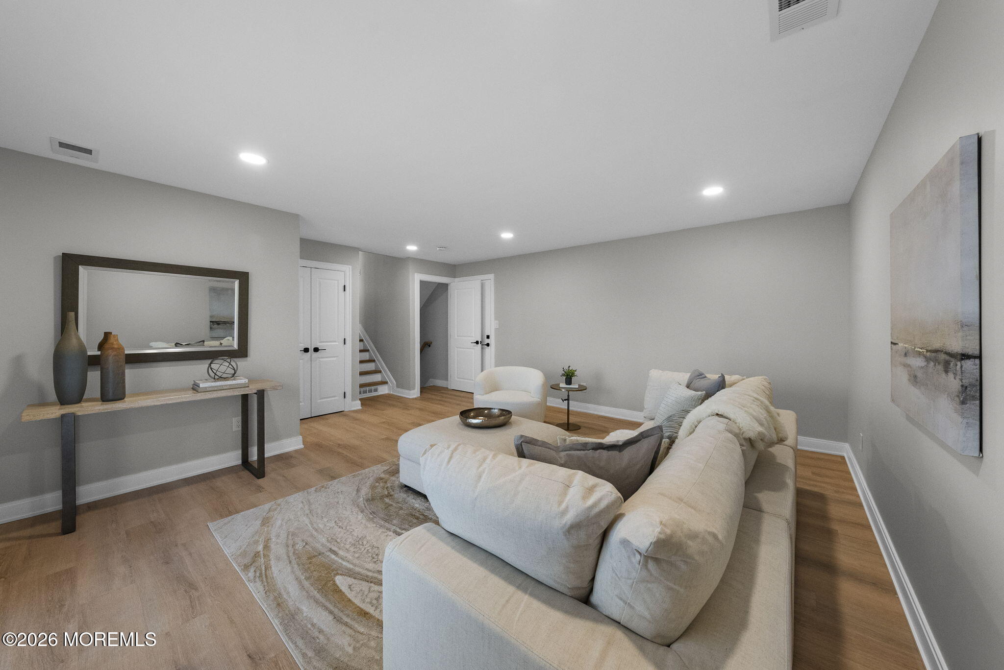 64 South Cliff Road Colonia, NJ 07067 - Photo 22 of 49 a living room with furniture and a flat screen tv