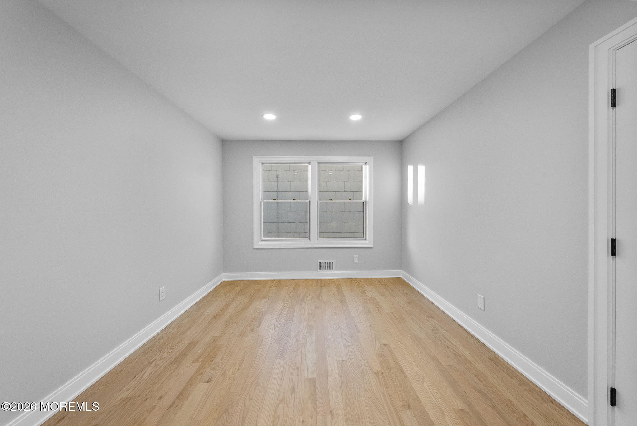 64 South Cliff Road Colonia, NJ 07067 - Photo 30 of 49 a view of an empty room with wooden floor and a window