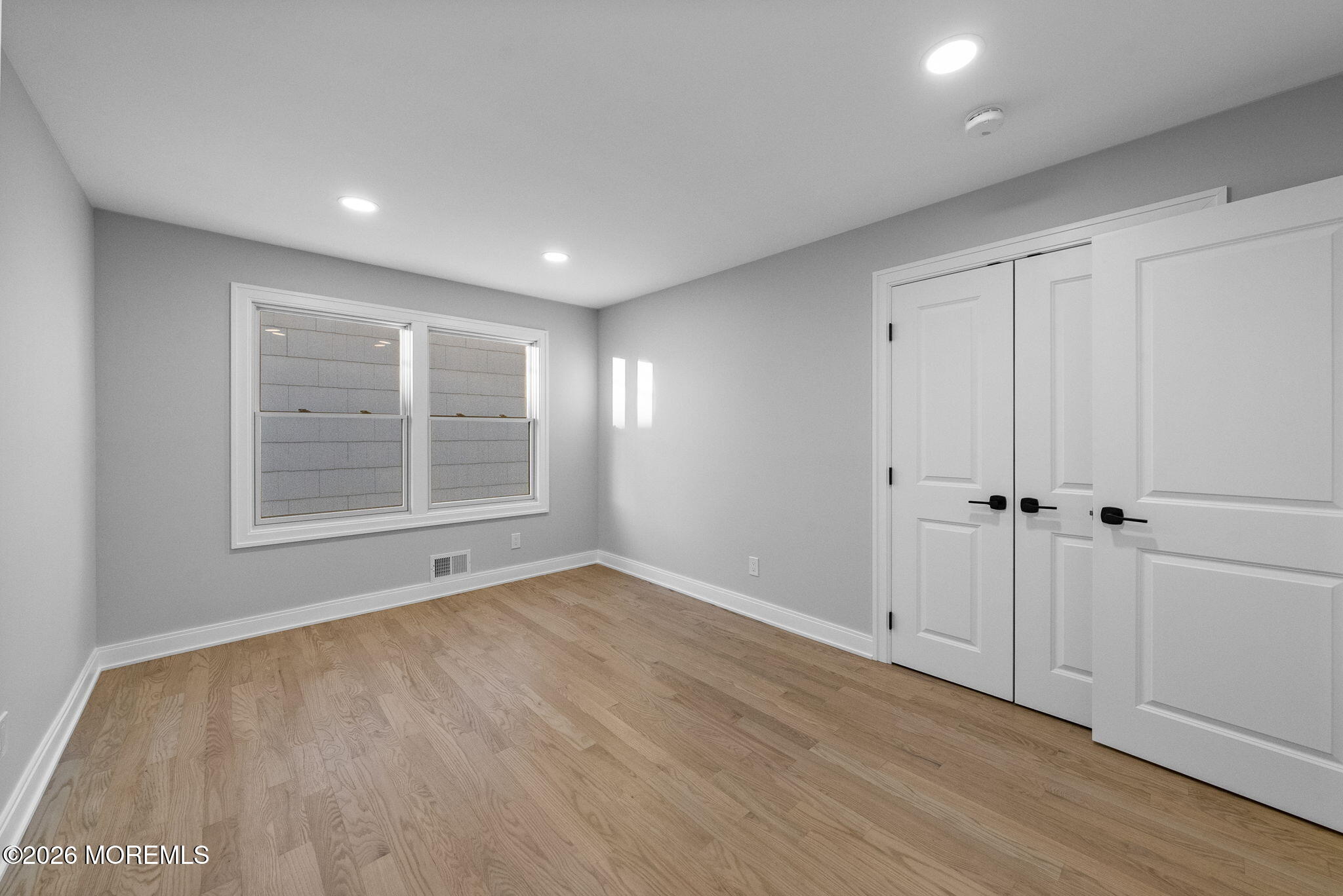 64 South Cliff Road Colonia, NJ 07067 - Photo 31 of 49 a view of an empty room with wooden floor and closet