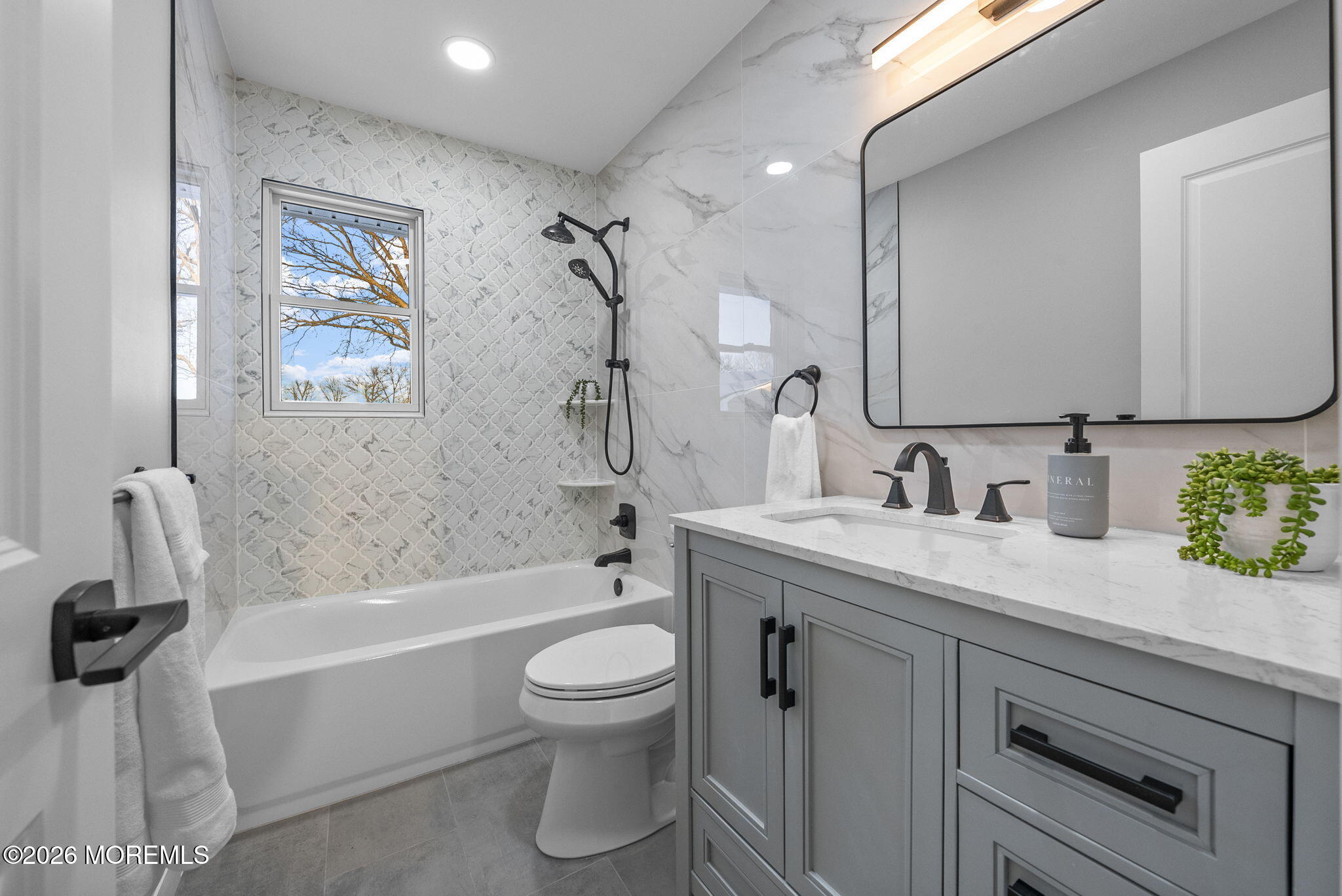 64 South Cliff Road Colonia, NJ 07067 - Photo 34 of 49 a bathroom with a granite countertop sink toilet and bathtub