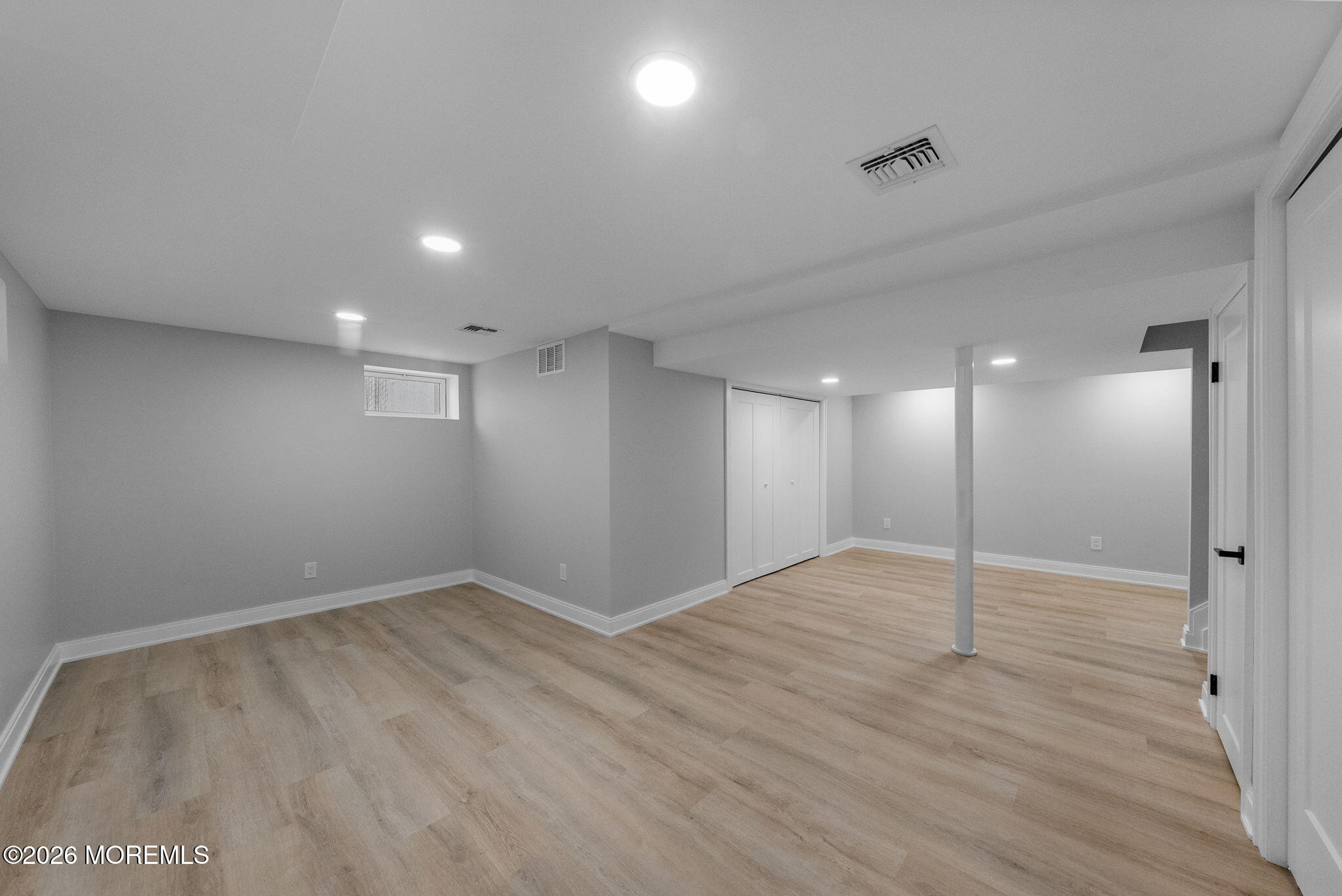 64 South Cliff Road Colonia, NJ 07067 - Photo 35 of 49 an empty room with wooden floor and windows