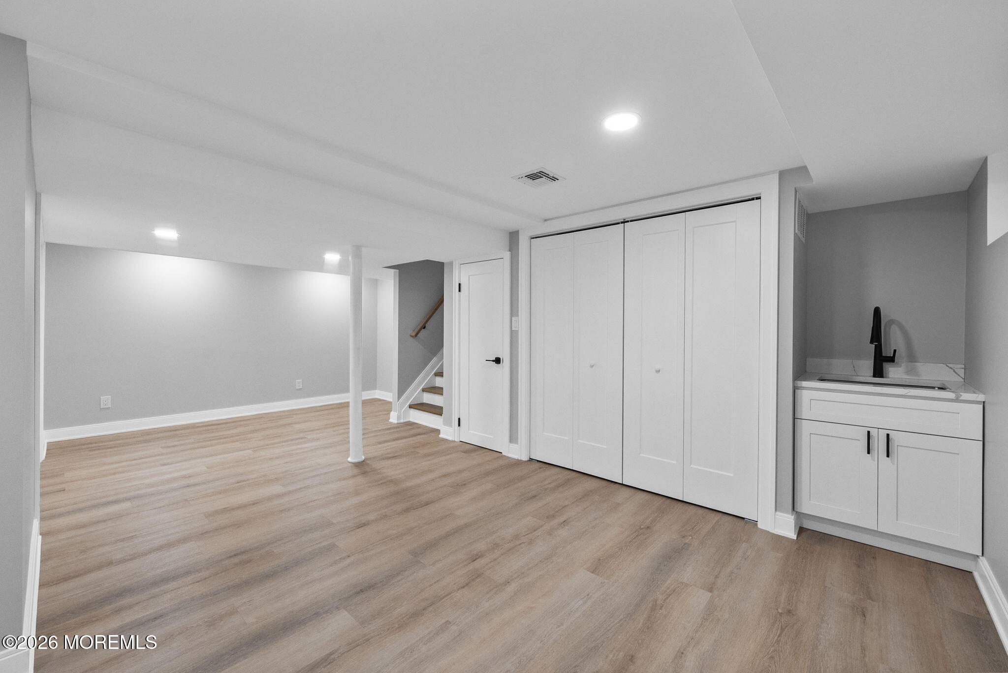 64 South Cliff Road Colonia, NJ 07067 - Photo 37 of 49 a view of an empty room with window and wooden floor