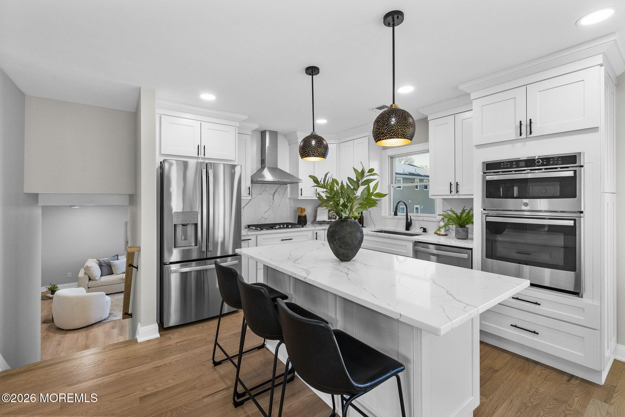 64 South Cliff Road Colonia, NJ 07067 - Photo 8 of 49 a kitchen with stainless steel appliances a dining table chairs and refrigerator