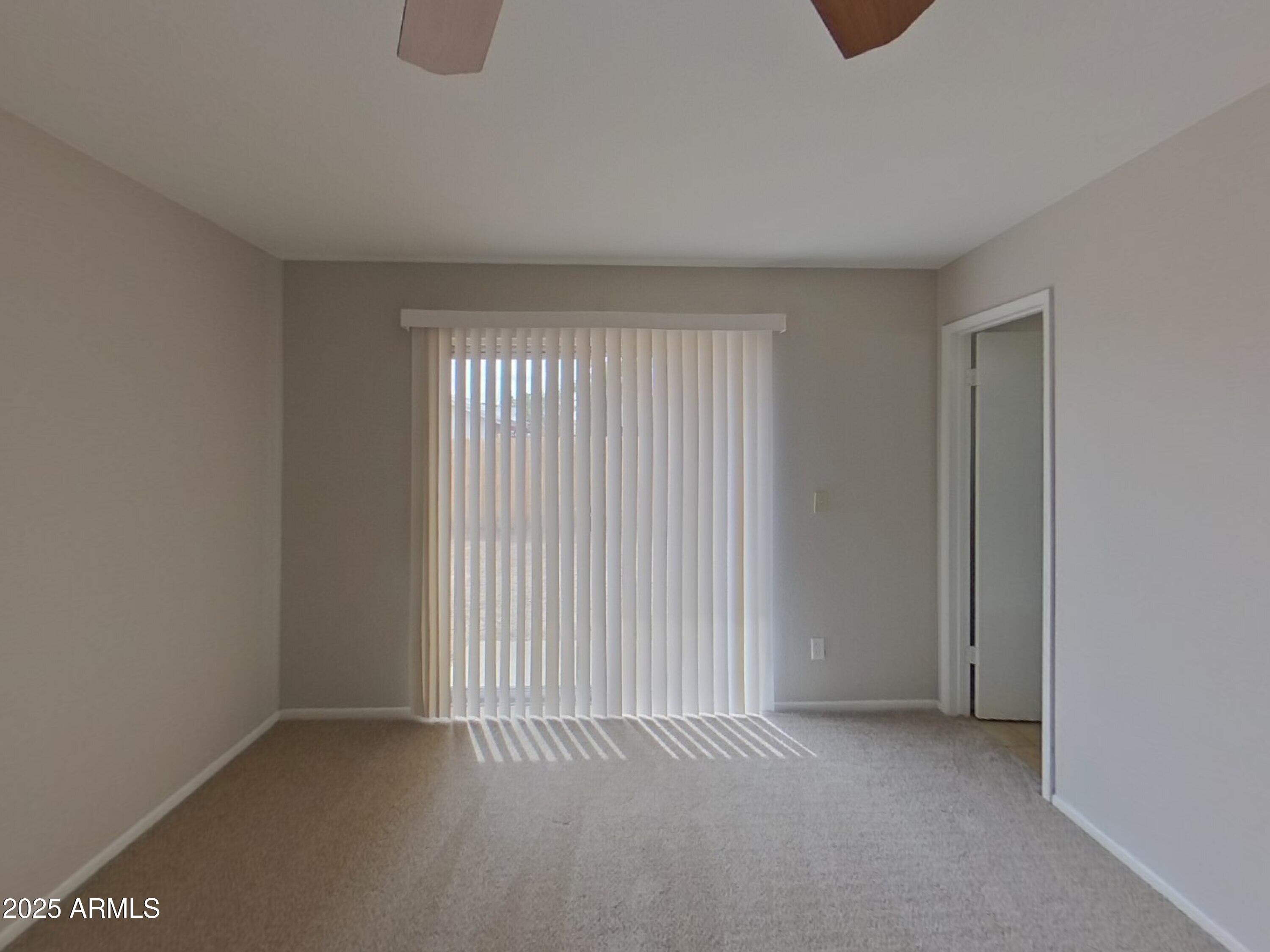 7955 West Montecito Avenue Phoenix, AZ 85033 - Photo 9 of 19 a view of an empty room with a window