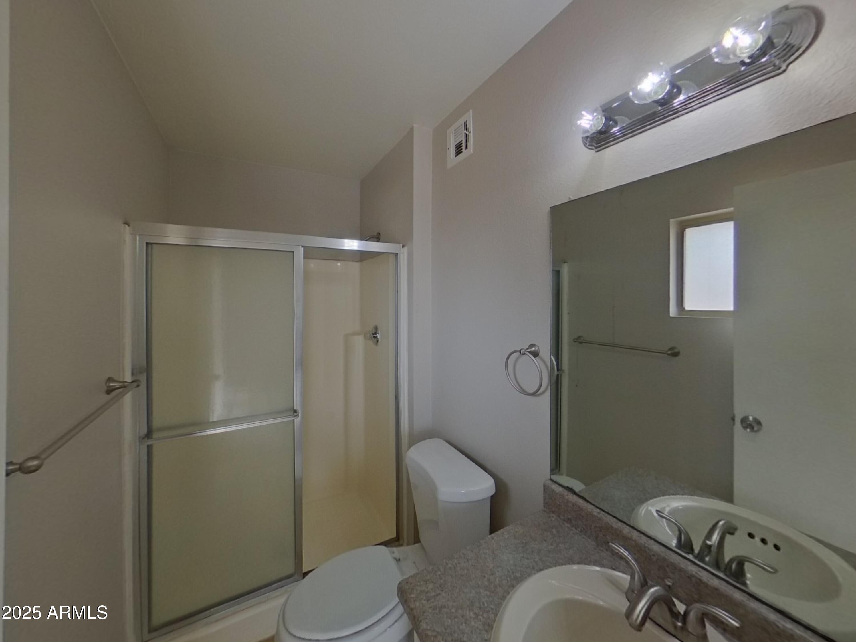 7955 West Montecito Avenue Phoenix, AZ 85033 - Photo 10 of 19 a bathroom with a sink toilet and shower