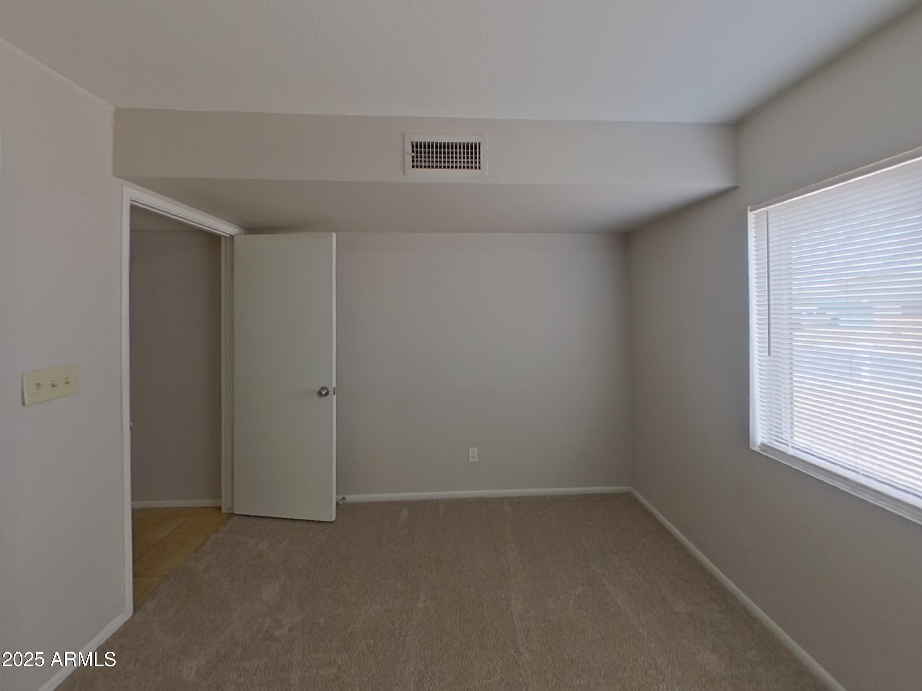 7955 West Montecito Avenue Phoenix, AZ 85033 - Photo 11 of 19 an empty room with a window