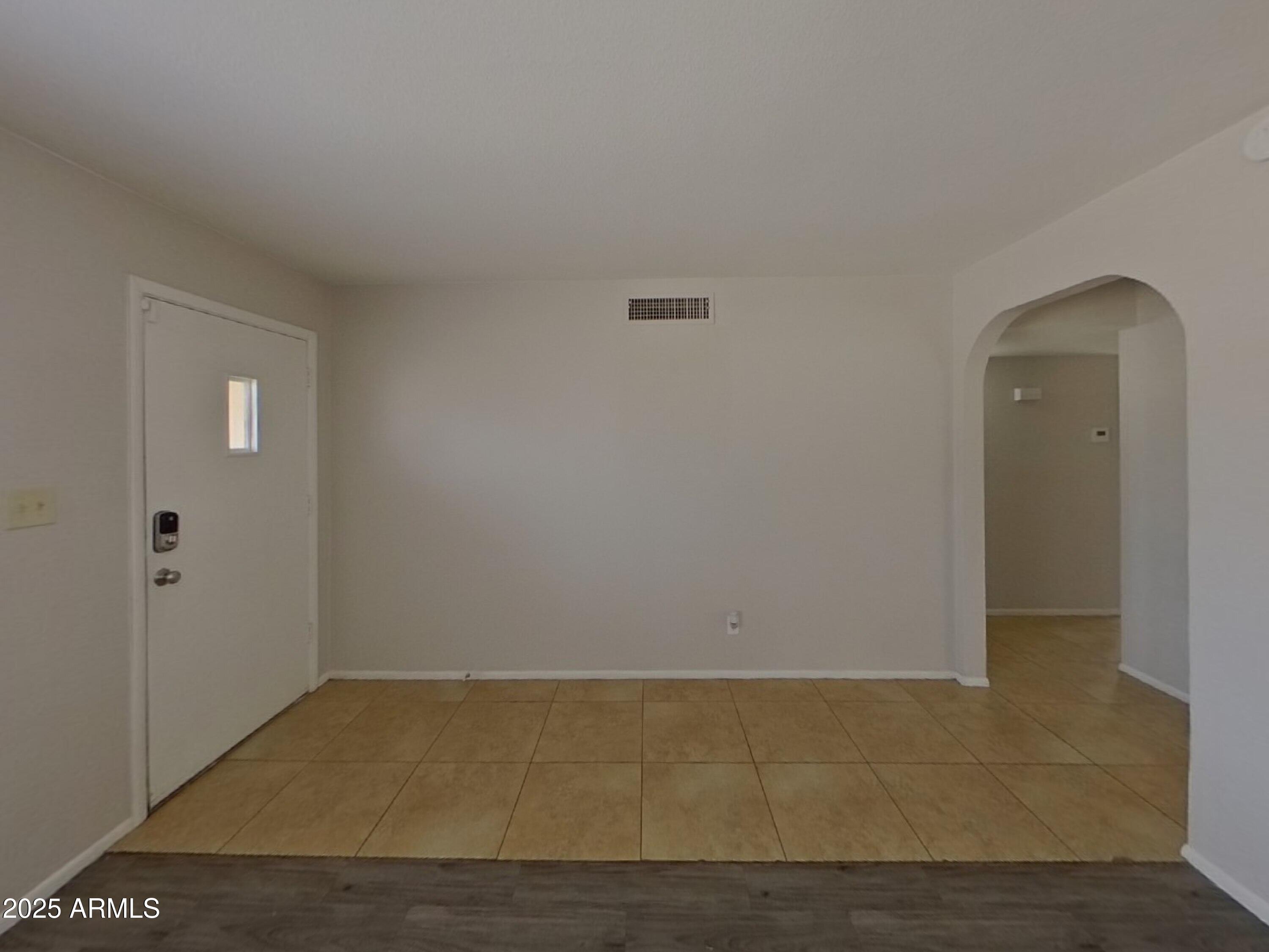 7955 West Montecito Avenue Phoenix, AZ 85033 - Photo 2 of 19 a view of an empty room