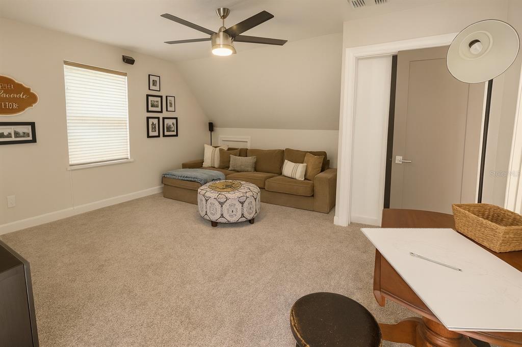 21135 Peckham Avenue Mount Dora, FL 32757 - Photo 18 of 39 a living room with furniture and a window