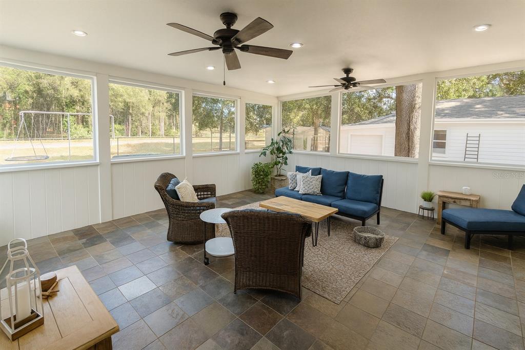 21135 Peckham Avenue Mount Dora, FL 32757 - Photo 23 of 39 a living room with furniture and a large window