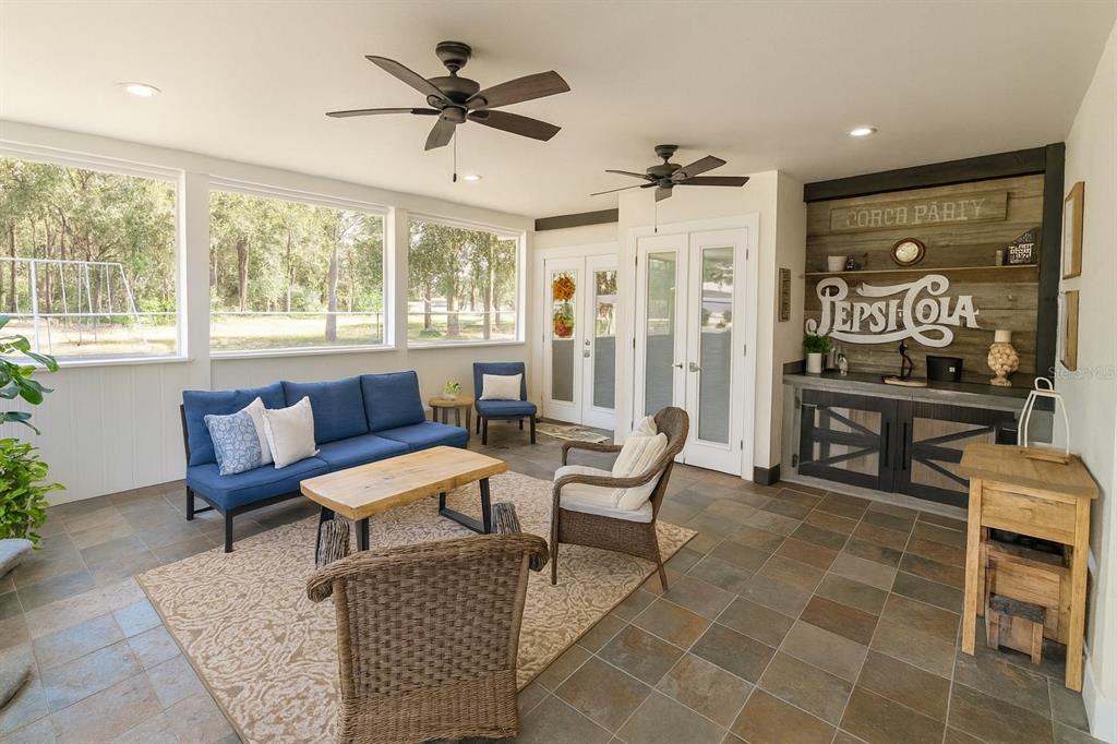 21135 Peckham Avenue Mount Dora, FL 32757 - Photo 25 of 39 a living room with furniture and a large window