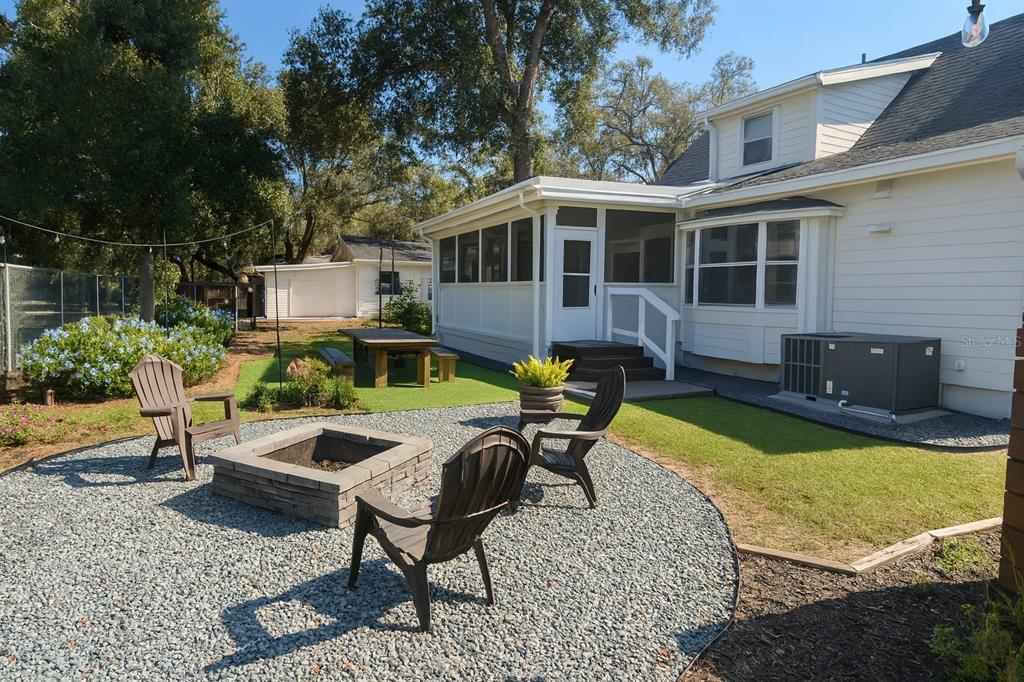 21135 Peckham Avenue Mount Dora, FL 32757 - Photo 31 of 39 a view of a house with swimming pool and sitting area