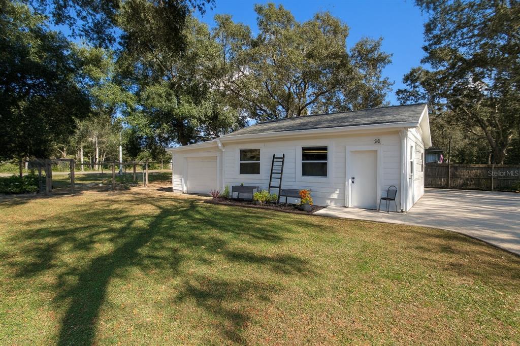 21135 Peckham Avenue Mount Dora, FL 32757 - Photo 34 of 39 a view of a house with backyard and trees