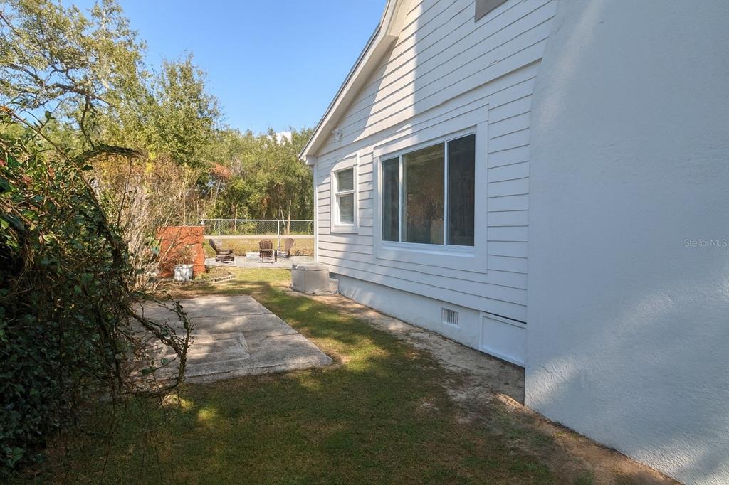 21135 Peckham Avenue Mount Dora, FL 32757 - Photo 35 of 39 a view of a backyard with sitting area