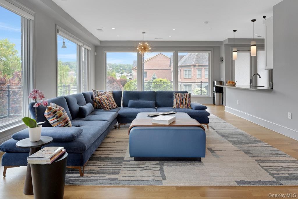 18 Rivers Edge Drive, Unit 211 Tarrytown, NY 10591 - Photo 5 of 30 a living room with furniture and a large window