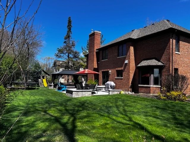 106 Ellendale Road Deerfield, IL 60015 - Photo 2 of 2 a view of a chairs and table in front of a house