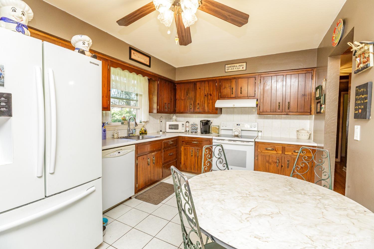 203 Butternut Road Califon, NJ 07830 - Photo 11 of 33 a kitchen with a refrigerator a sink and cabinets