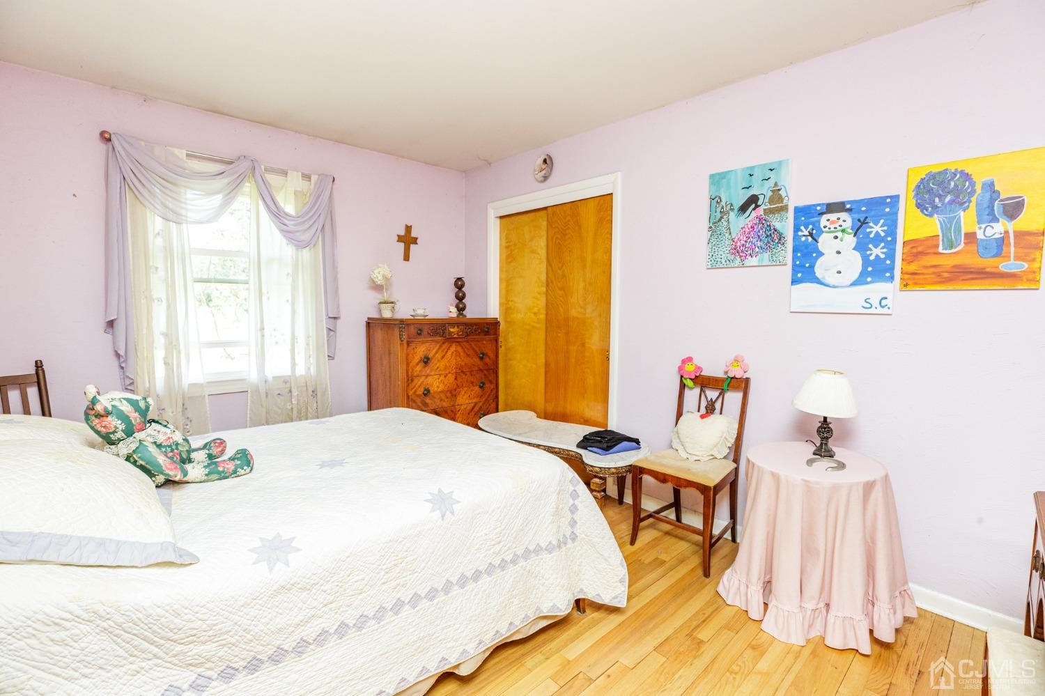 203 Butternut Road Califon, NJ 07830 - Photo 13 of 33 a bedroom with a bed and wooden floor