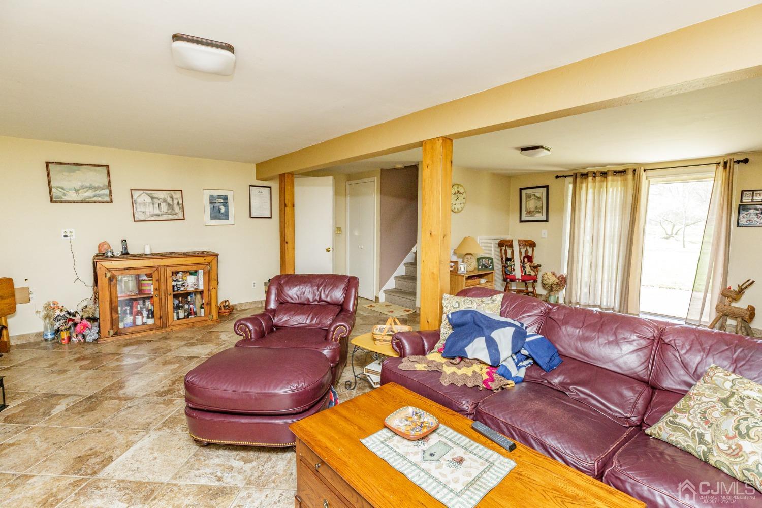 203 Butternut Road Califon, NJ 07830 - Photo 22 of 33 a living room with furniture fireplace and a flat screen tv