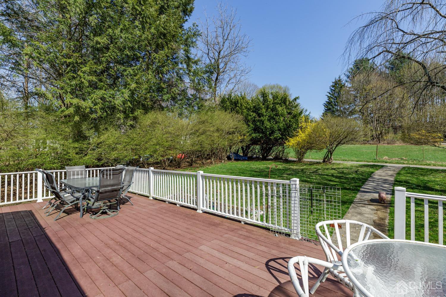 203 Butternut Road Califon, NJ 07830 - Photo 26 of 33 a view of a chair and table on the wooden deck