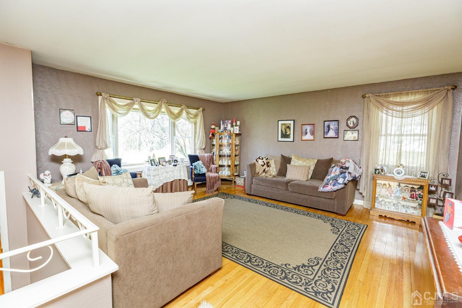 203 Butternut Road Califon, NJ 07830 - Photo 3 of 33 a living room with furniture and a large window
