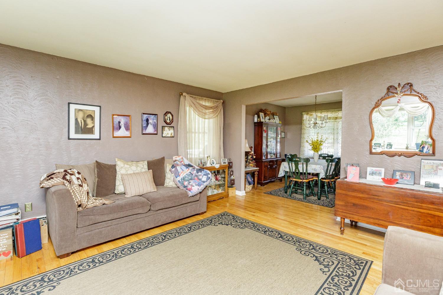 203 Butternut Road Califon, NJ 07830 - Photo 5 of 33 a living room with furniture and a large window