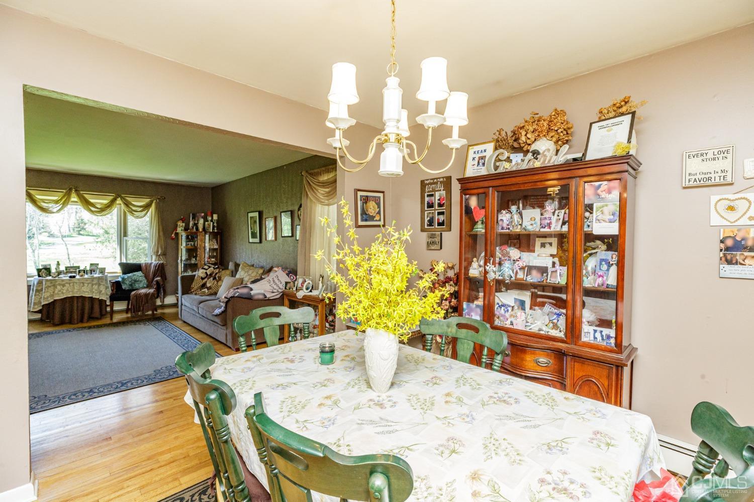 203 Butternut Road Califon, NJ 07830 - Photo 6 of 33 a view of a dining room with furniture and a potted plant