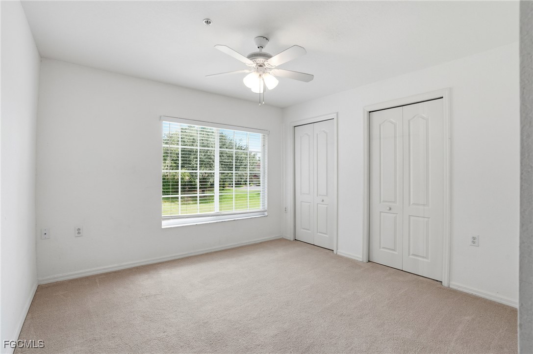 9409 Ivy Brook Run, Unit 1306 Fort Myers, FL 33913 - Photo 20 of 43 a view of a livingroom with a ceiling fan and window