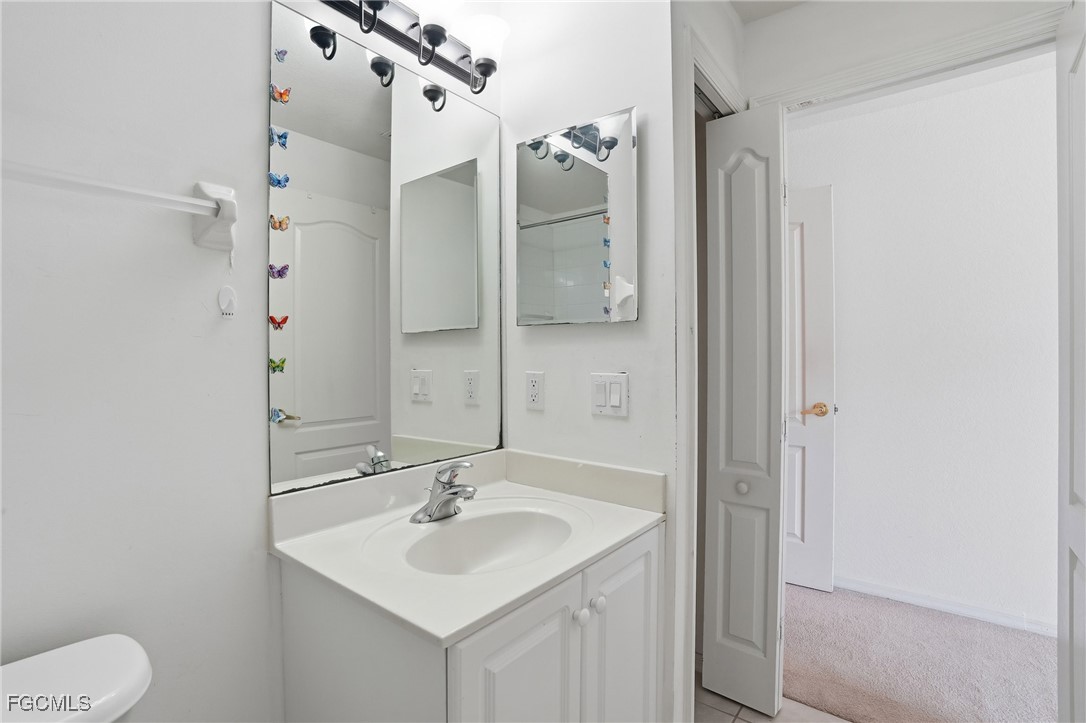 9409 Ivy Brook Run, Unit 1306 Fort Myers, FL 33913 - Photo 22 of 43 a bathroom with a sink toilet and shower